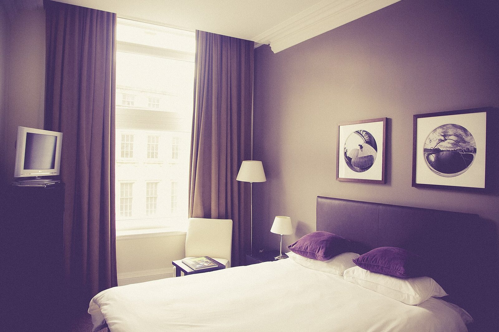 Bedroom with closed blackout curtains blocking daylight
